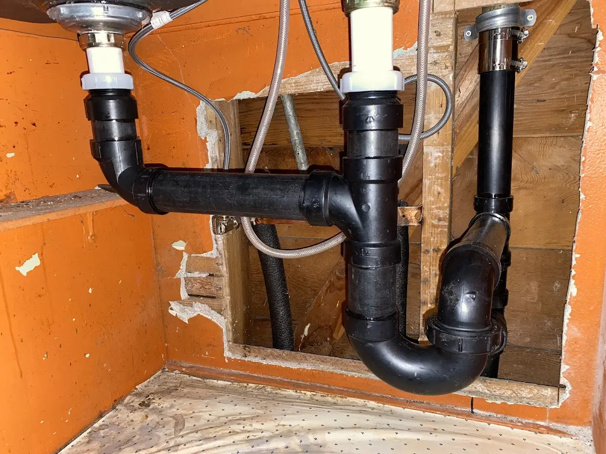 Professional Garbage Disposal Repair equipment and tools on the job in West New York